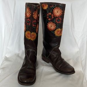 Embroidered brown leather boots.
